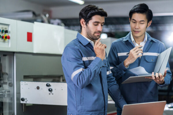 male-asian-caucasian-engineer-professional-having-discussion-standing-consult-machine-factory-two-expert-coworker-brainstorm-explaining-solves-process-cnc-operate-machine